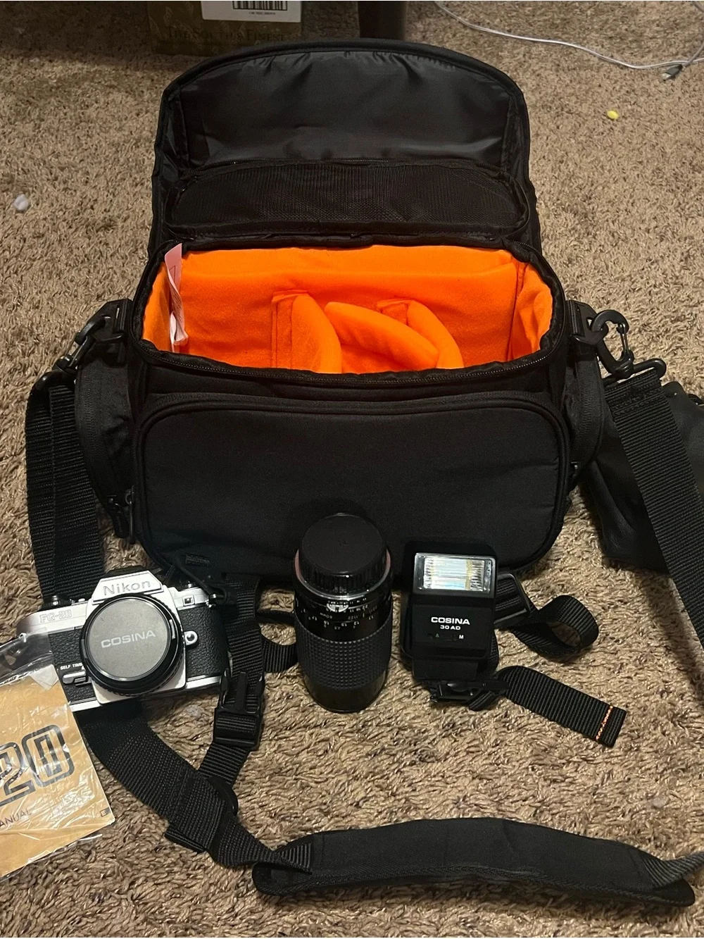 Nikon 35 MM  with flash & lens. Black Camera Bag with Bright Orange  Interior.